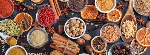 Obraz  z motywem Spices and herbs. Colorful spices flat lay on wooden table