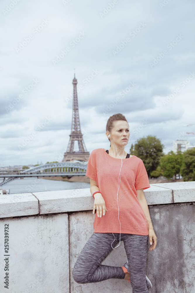 Fototapeta premium healthy sports woman listening to music with headphones