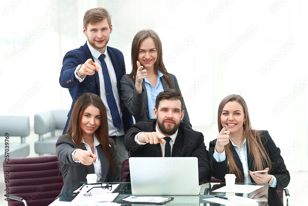 successful business team with hands pointing forward successful business team with hands pointing forward