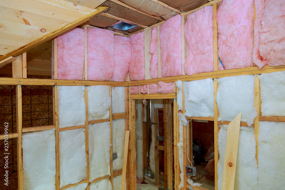 Wooden frame for future walls insulated with rock wool and fiberglass insulation - obrazy, fototapety, plakaty 