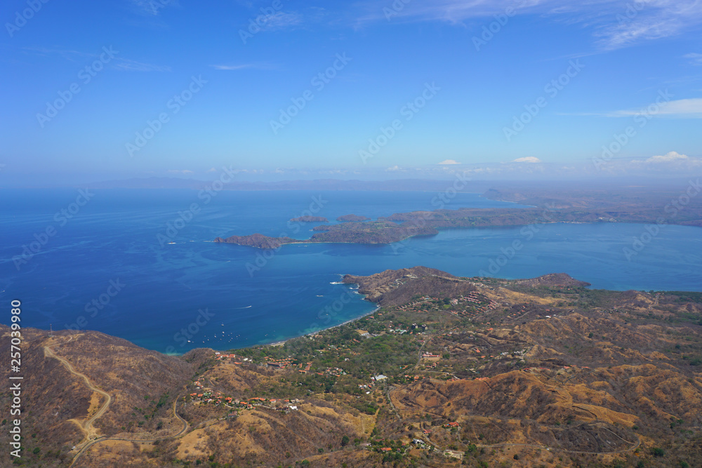Aerial view of the Golfo del Papagayo with the Peninsula Papagayo near Liberia, Guanacaste, Costa Rica, during the dry season Aerial view of the Golfo del Papagayo with the Peninsula Papagayo near Liberia, Guanacaste, Costa Rica, during the dry season