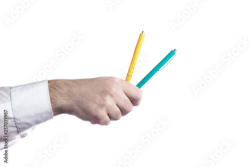 Hand holding two pens isolated on white background