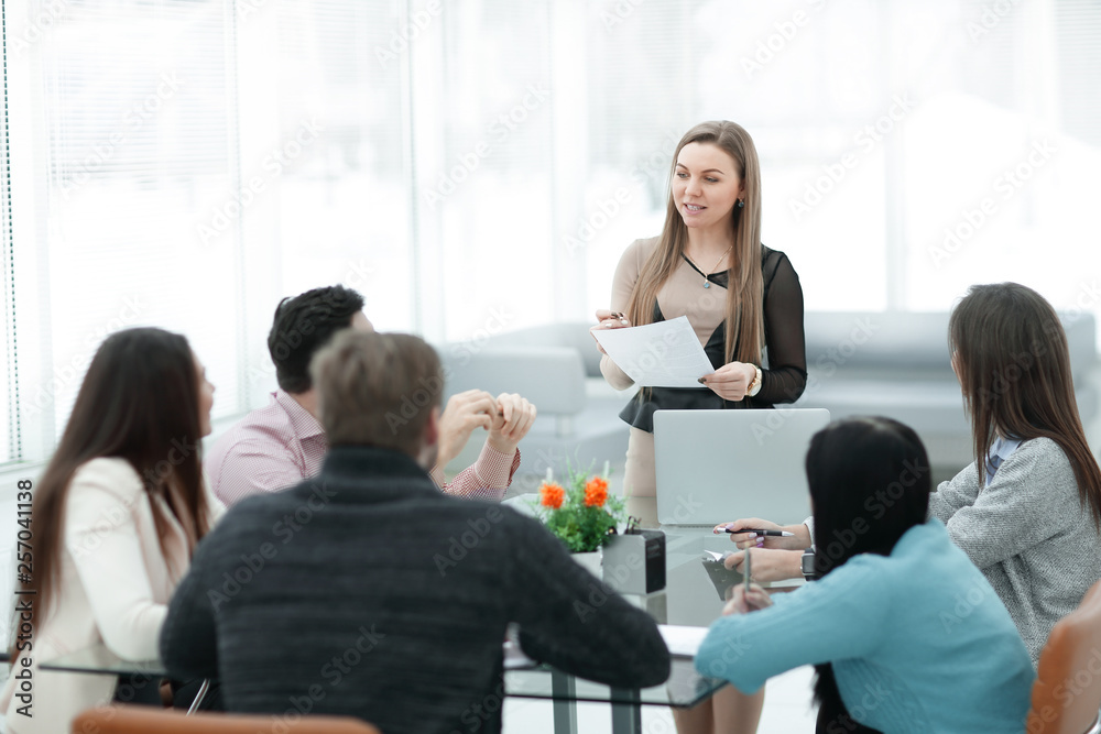 business woman at a briefing with the business team business woman at a briefing with the business team