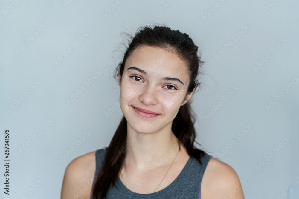 kind look in the camera of a teenager girl, close-up portrait kind look in the camera of a teenager girl, close-up portrait