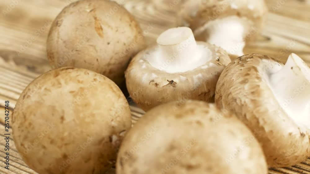 Close up of mushrooms on wood kitchen surface. Close up 4k footage. Close up of mushrooms on wood kitchen surface. Close up 4k footage.