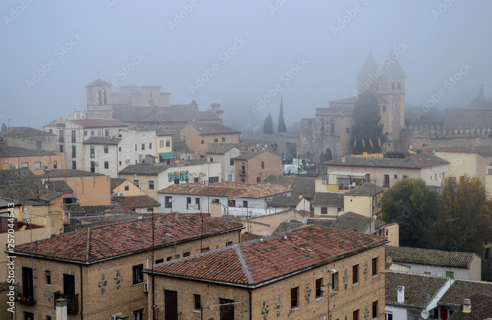 Panoramic morning view of Toledo in the fog.