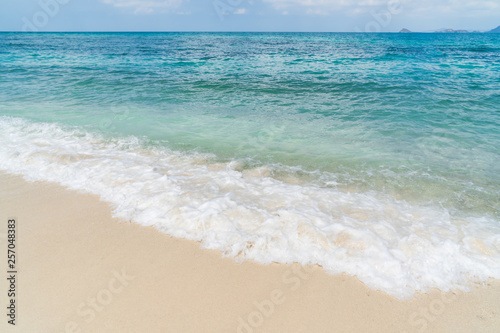 Beautiful seascape with white sand and wave at tropical beach