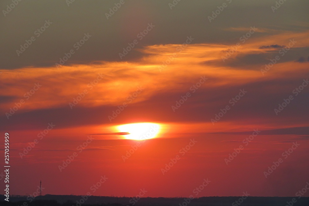 Beautiful red sunset view over the field, natural sky background