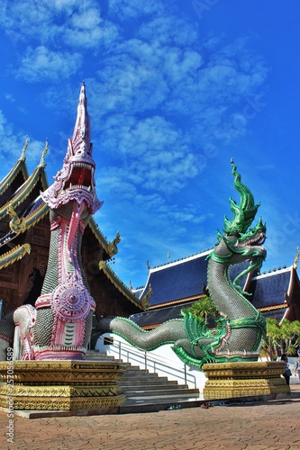 beautiful of two Naga in front of the church at Banden temple, Chiang Mai, Thailand. Naga sculpture in front of the Thai temple and sky background. Thai modern culture.
