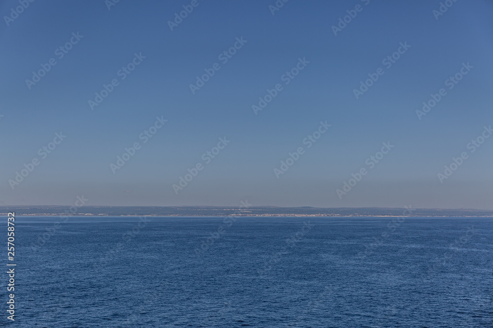Landscape formed by a beautiful sea and a clear blue sky on a summer day Landscape formed by a beautiful sea and a clear blue sky on a summer day