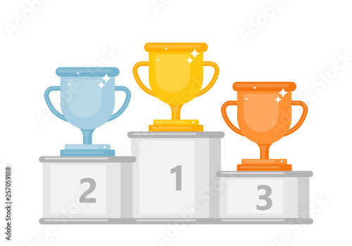 Winner podium with gold, silver and bronze trophy cups.