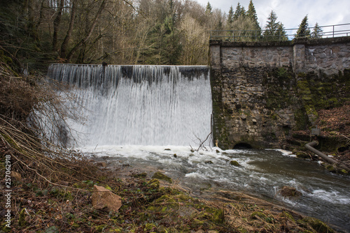 dam with overflowing water photo