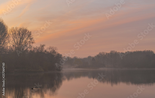 Foggy sunrise over lake Padersee