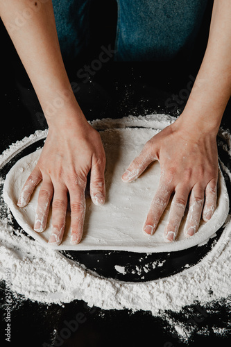chef hands knead dough