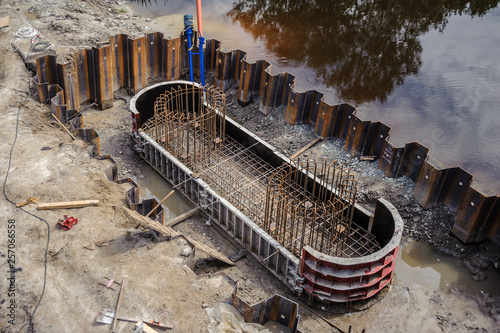 Metal radial formwork with reinforcement cage for concreting bridge supports. © Vitaliy