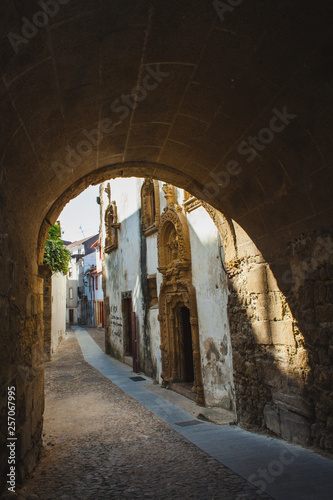 pedestrian street trough the arch in Coimbra, Portugal