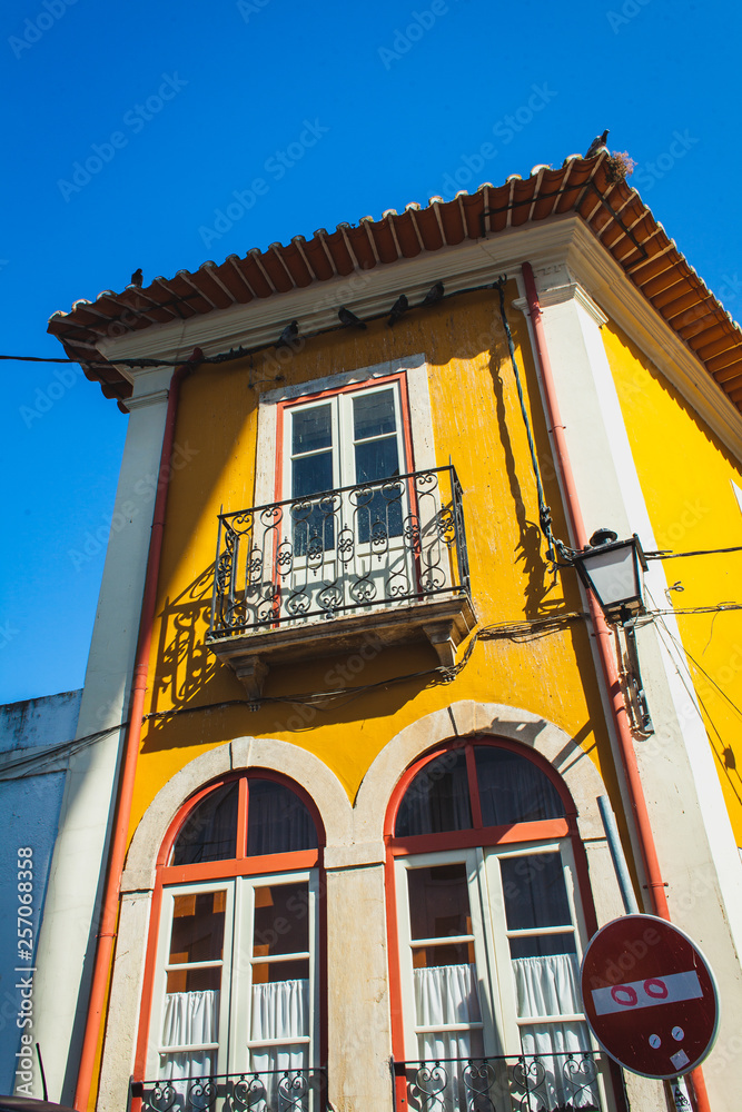 old yellow house with balcon in Coimbra, Portugal