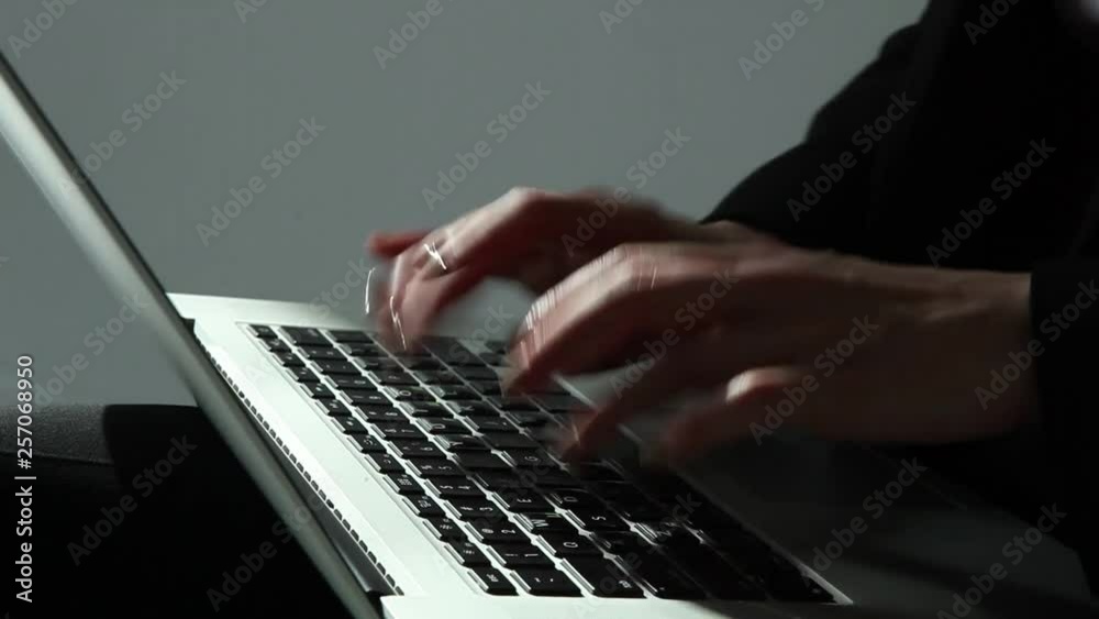 Woman typing on laptop keyboard in the office. Close up woman hands writing on laptop computer keyboard. Woman typing on laptop keyboard in the office. Close up woman hands writing on laptop computer keyboard.