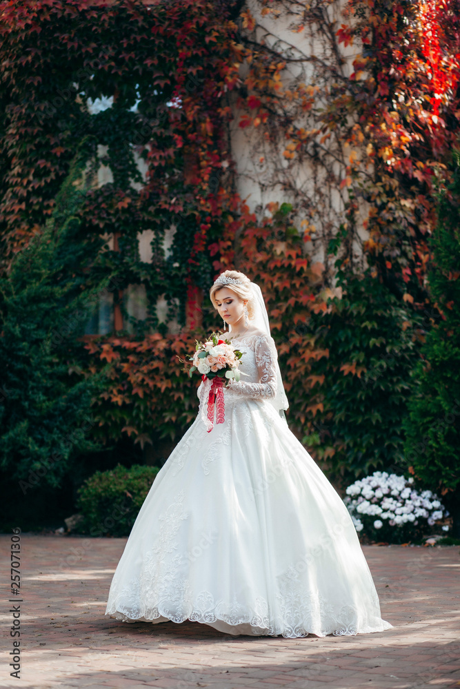 Portrait of a young beautiful bride with a bouquet Portrait of a young beautiful bride with a bouquet