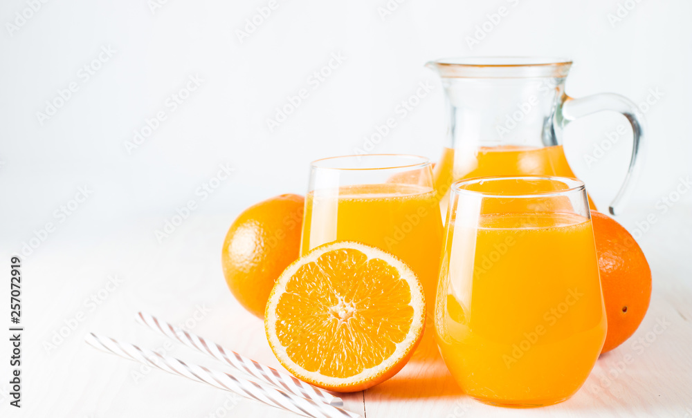 Close-up of a glass of orange juice with oranges fruits on wooden and stone background. Vitamins and minerals. Healthy drink and beverage concept. Close-up of a glass of orange juice with oranges fruits on wooden and stone background. Vitamins and minerals. Healthy drink and beverage concept.