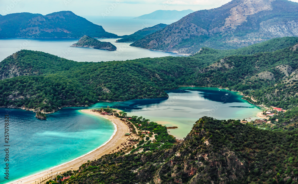 Close up view of Oludeniz Beach and bay with Paradliding, Fethiye, Mugla, Turkey. Aerial Photo from Lycian way. Summer and holiday concept