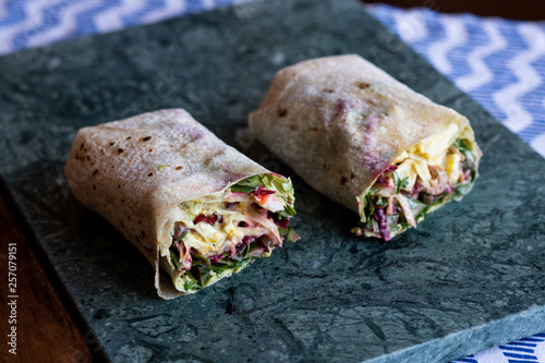 Vegetarian Wraps with beetroot, red cabbage, arugula and humus photo