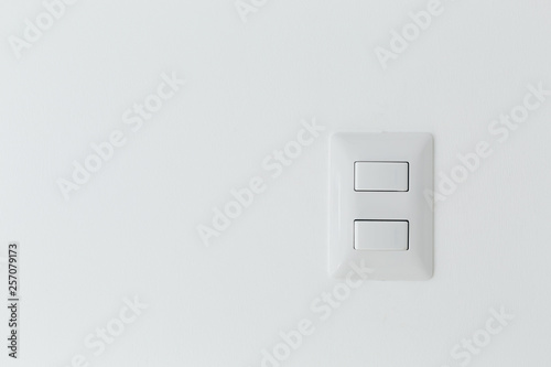 Switch light panel on white wall interior