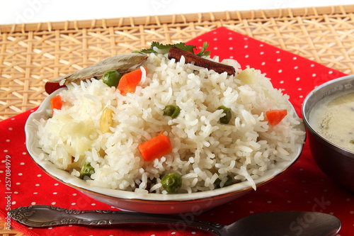Indian food vegetable traditional cooked pulav rice or Basmati rice biryani with kadhi