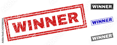 Grunge WINNER rectangle stamp seals isolated on a white background. Rectangular seals with grunge texture in red, blue, black and grey colors.