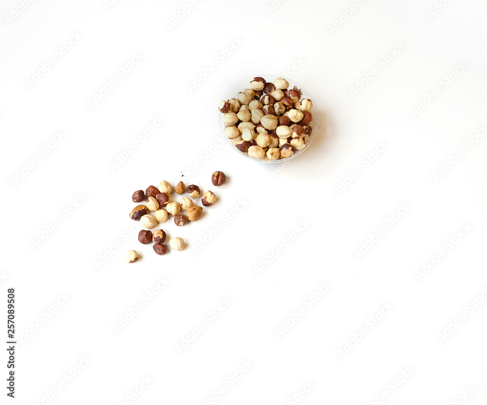 Healthy food for background image close up hazelnuts. Nuts texture on white grey table top view on the cup plate Healthy food for background image close up hazelnuts. Nuts texture on white grey table top view on the cup plate