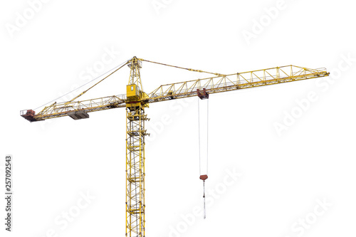 high-rise construction crane with a long arrow of yellow color on a white background photo