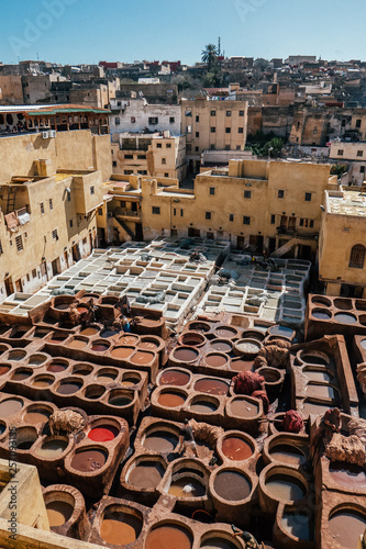 traditional tannery in the medina in fez, morocco © SmallWorldProduction