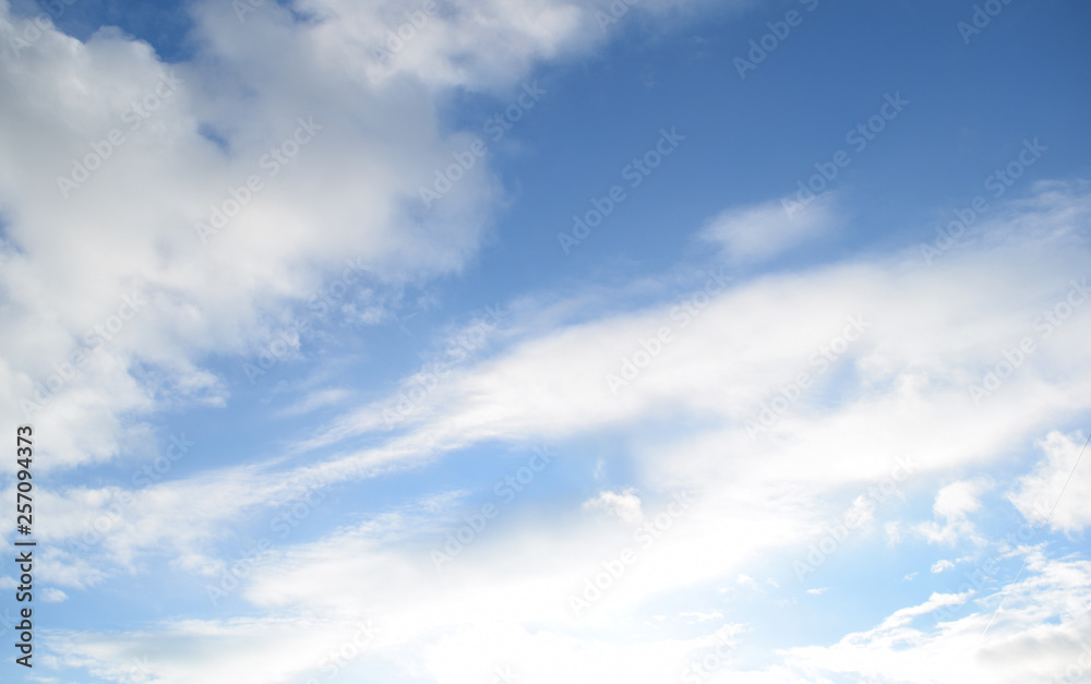 Fabulous blue sky background with white clouds. Nature texture.