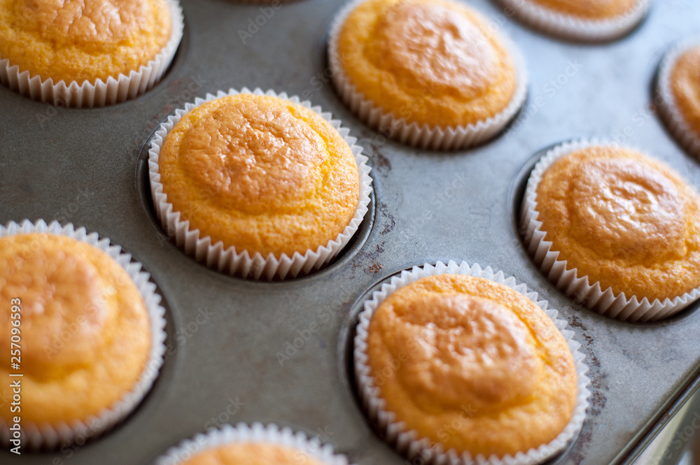 Freshly baked cornbread in paper cups just taken from the oven Freshly baked cornbread in paper cups just taken from the oven