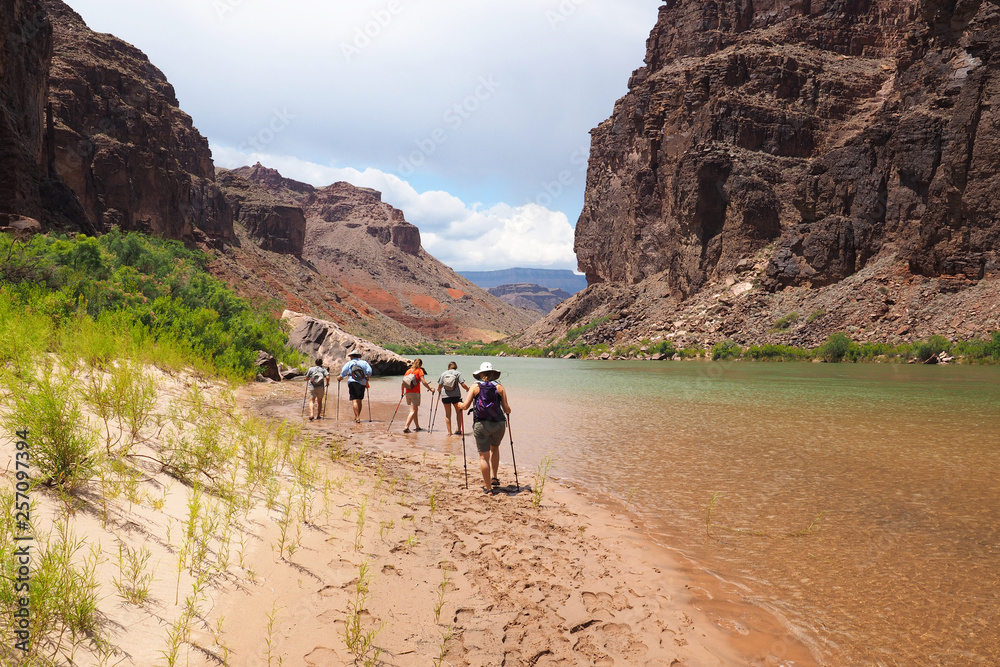 Backpackers resting on a beach just above Hance Rapids on the Colorado River in Grand Canyon National Park, Arizona. Backpackers resting on a beach just above Hance Rapids on the Colorado River in Grand Canyon National Park, Arizona.