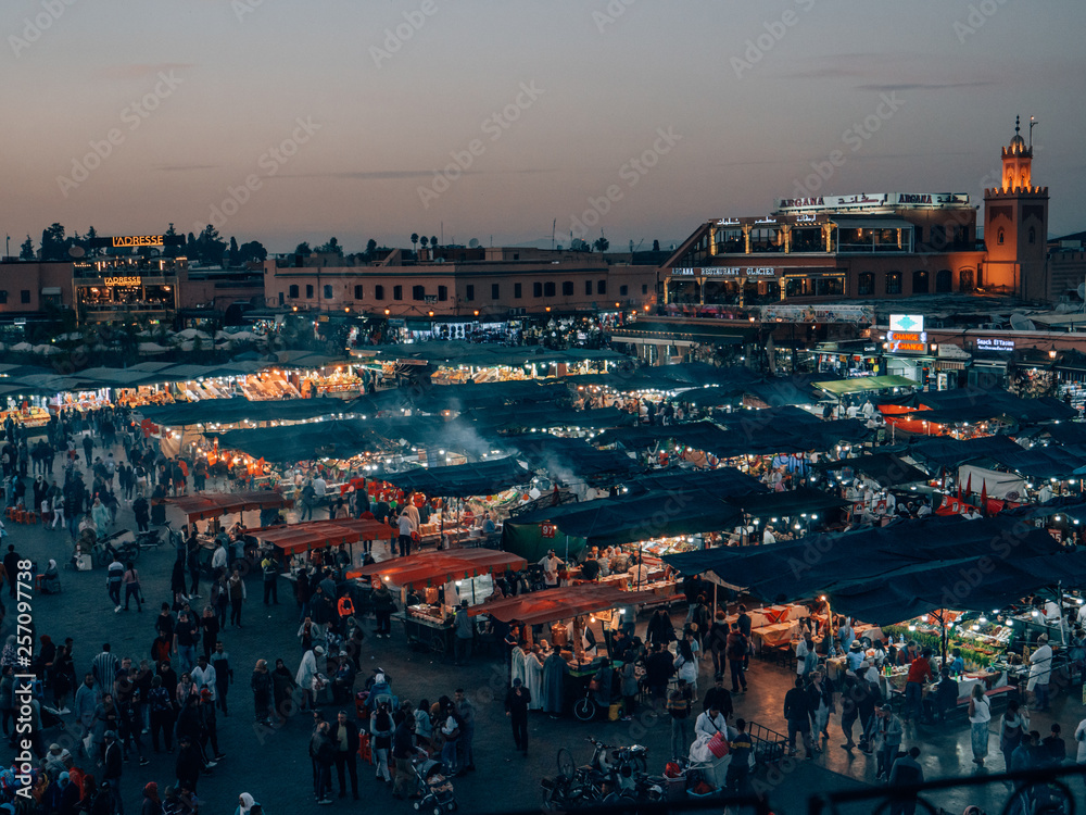 The famous hustle and bustle at the Djemaa el Fna at dusk in Marrakech.