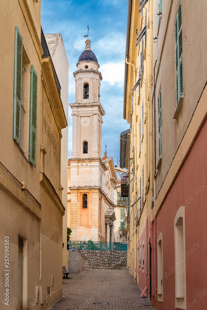 Menton, typical old street, with the saint michel archange church in background