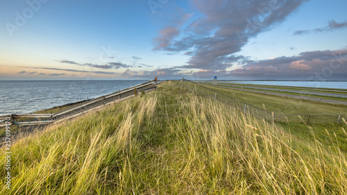 Afsluitdijk dutch dike sunset fence photo