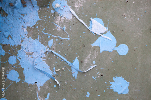 Fototapeta Naklejka Na Ścianę i Meble -  Renovating the house. Repair. Concept. Close up. Grunge background. Blue paint spilled on a concrete textured surface.