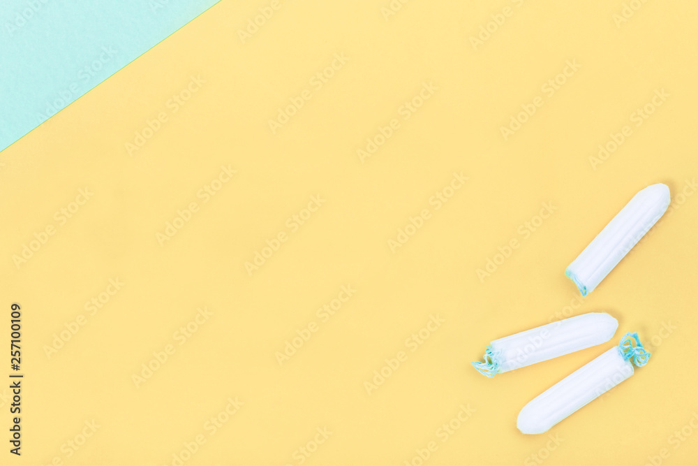 Tampons on creative colour background