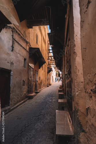 One of the winding alleys of the ancient moroccan Medina in the northern city Fes. © SmallWorldProduction