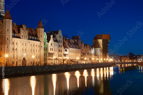 Old town in Gdansk, Poland at night. Riverside with the famous Crane and city reflections in the Motlava river.
