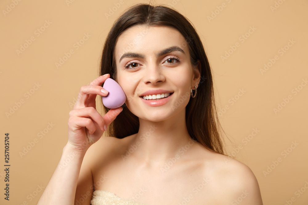 Close up brunette half naked woman 20s with perfect skin, nude make up isolated on beige pastel wall background, studio portrait. Skin care healthcare cosmetic procedures concept. Mock up copy space. Close up brunette half naked woman 20s with perfect skin, nude make up isolated on beige pastel wall background, studio portrait. Skin care healthcare cosmetic procedures concept. Mock up copy space.