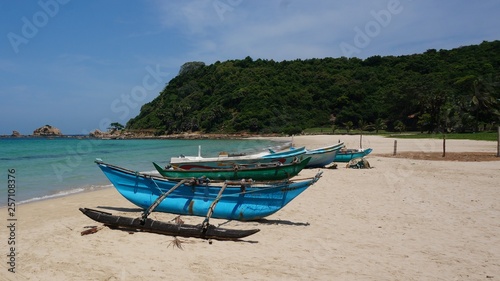 lonley beach with traditional old used fishing boats