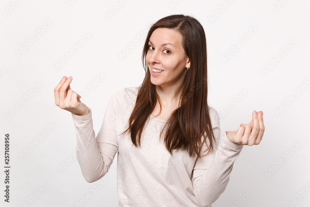 Smiling young woman in light clothes rubbing fingers, showing cash gesture asking for money isolated on white wall background in studio. People sincere emotions, lifestyle concept. Mock up copy space. Smiling young woman in light clothes rubbing fingers, showing cash gesture asking for money isolated on white wall background in studio. People sincere emotions, lifestyle concept. Mock up copy space.
