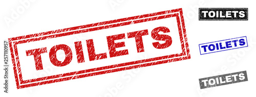 Grunge TOILETS rectangle stamp seals isolated on a white background. Rectangular seals with grunge texture in red, blue, black and gray colors.