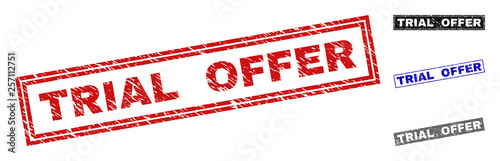 Grunge TRIAL OFFER rectangle stamp seals isolated on a white background. Rectangular seals with grunge texture in red, blue, black and grey colors.