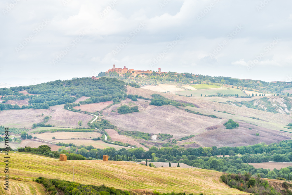 Pienza skyline and Italy Val D'Orcia countryside in Tuscany with hilltop small town village high angle cityscape