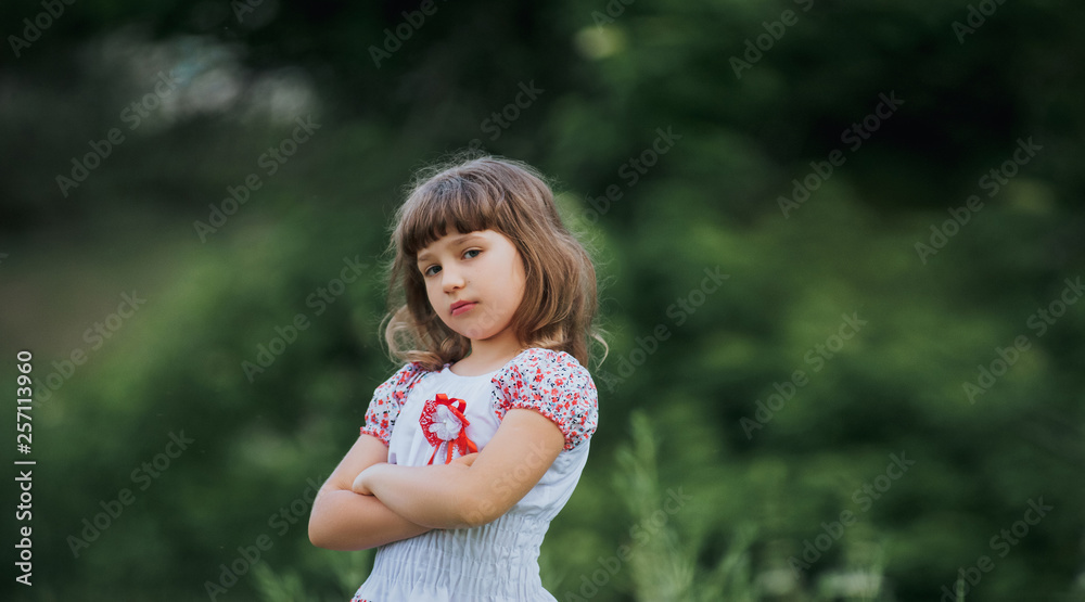 Beautiful, sweet and chubby Ukrainian girl on the background of nature with  greens. Cute child portrait close up. Young child with hairstyle posing in  national dress. Natural photography. Stock Photo | Adobe