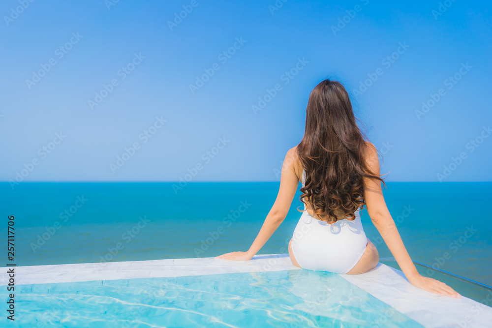 Portrait beautiful young asian woman happy smile relax in swimming pool for travel vacation Portrait beautiful young asian woman happy smile relax in swimming pool for travel vacation